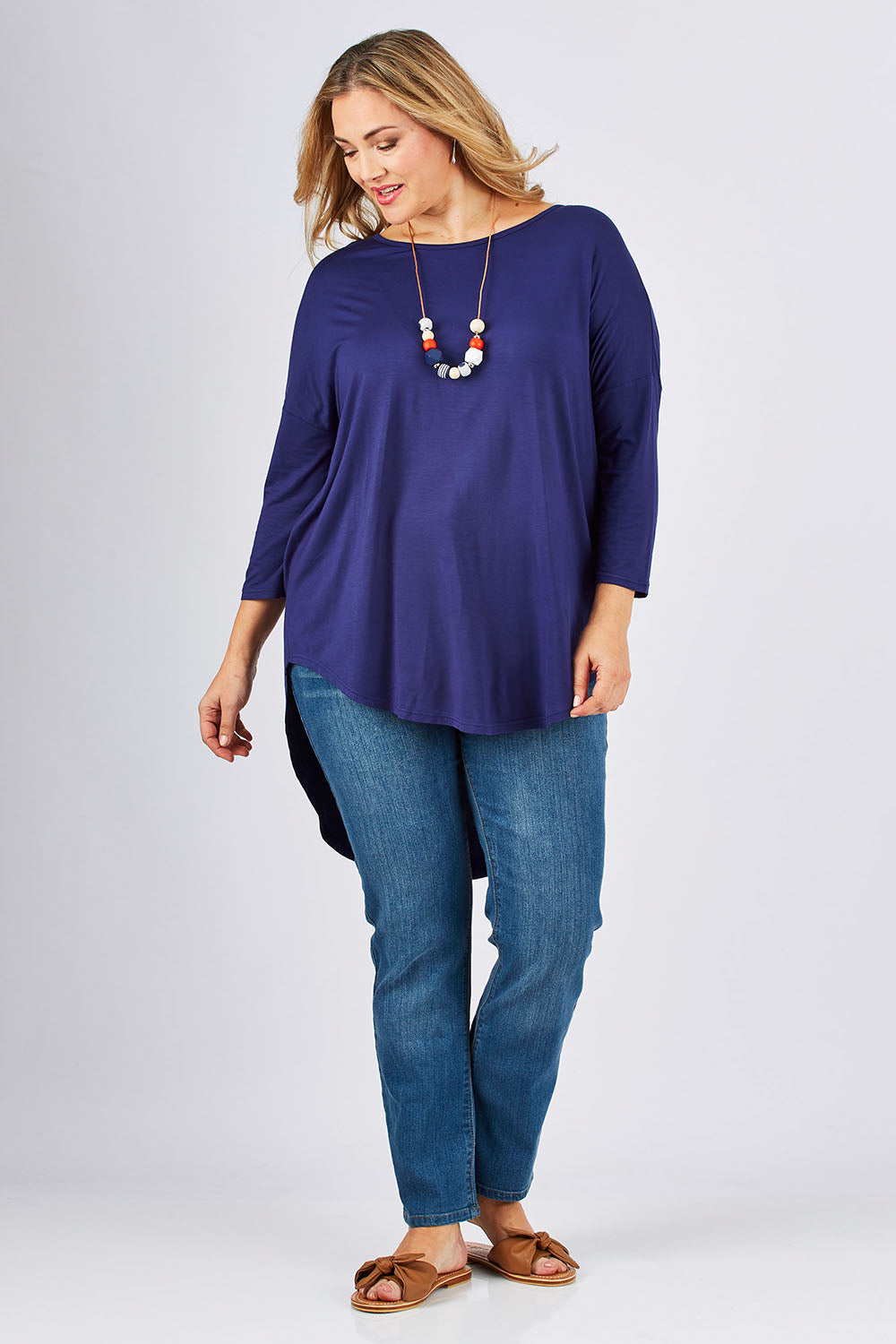 Model Ljubenka wearing size 18 of The Classic Straight Leg Jean in colour BlueWash (Blue), from the front, showing the whole outfit