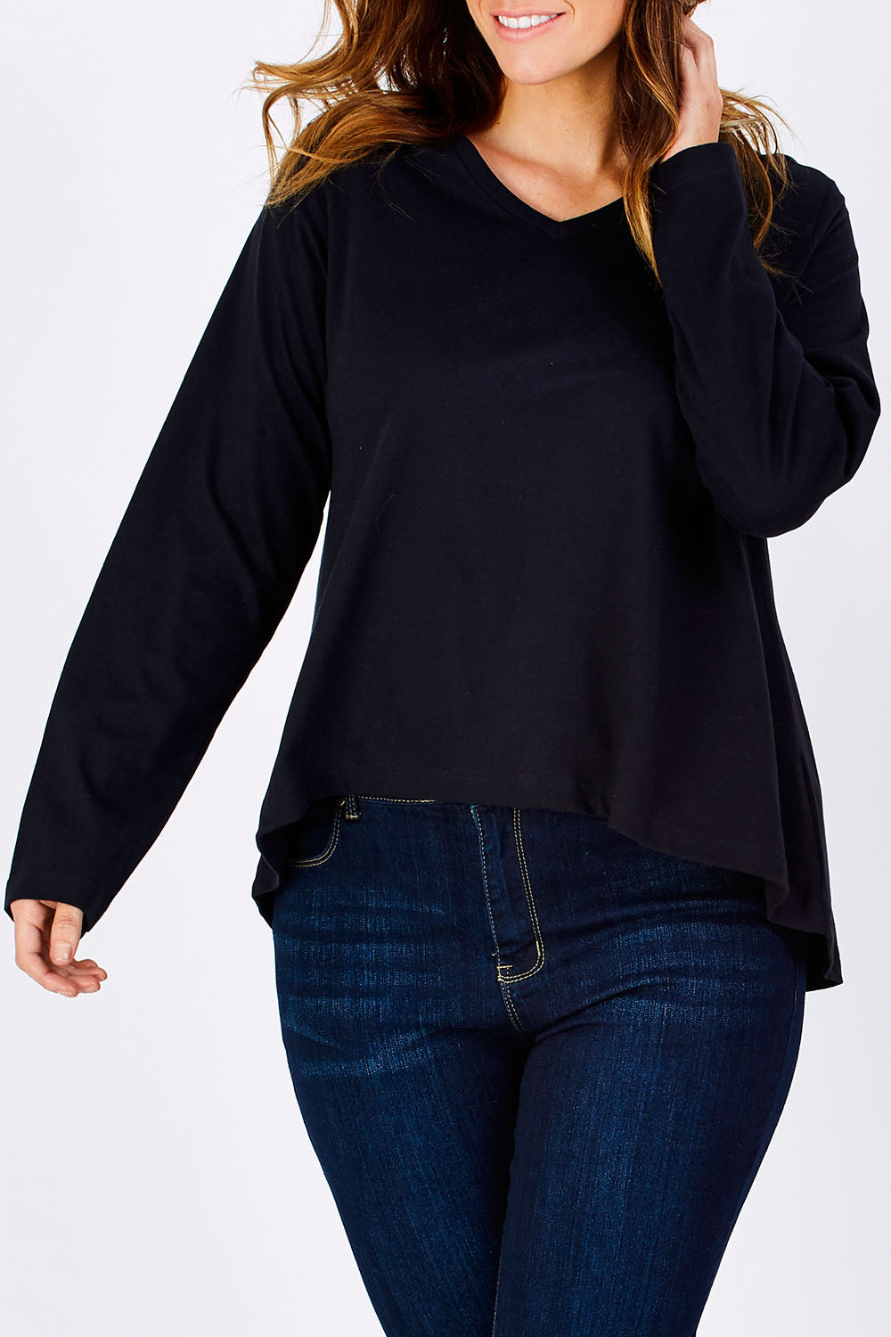 Model Laura wearing size 12 of The V Neck Cotton Tee in colour Black (Black), from the front, cropped image