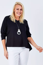 Model Natalie wearing size 16 of The V Neck Cotton Tee in colour Black (Black), from the front, cropped image