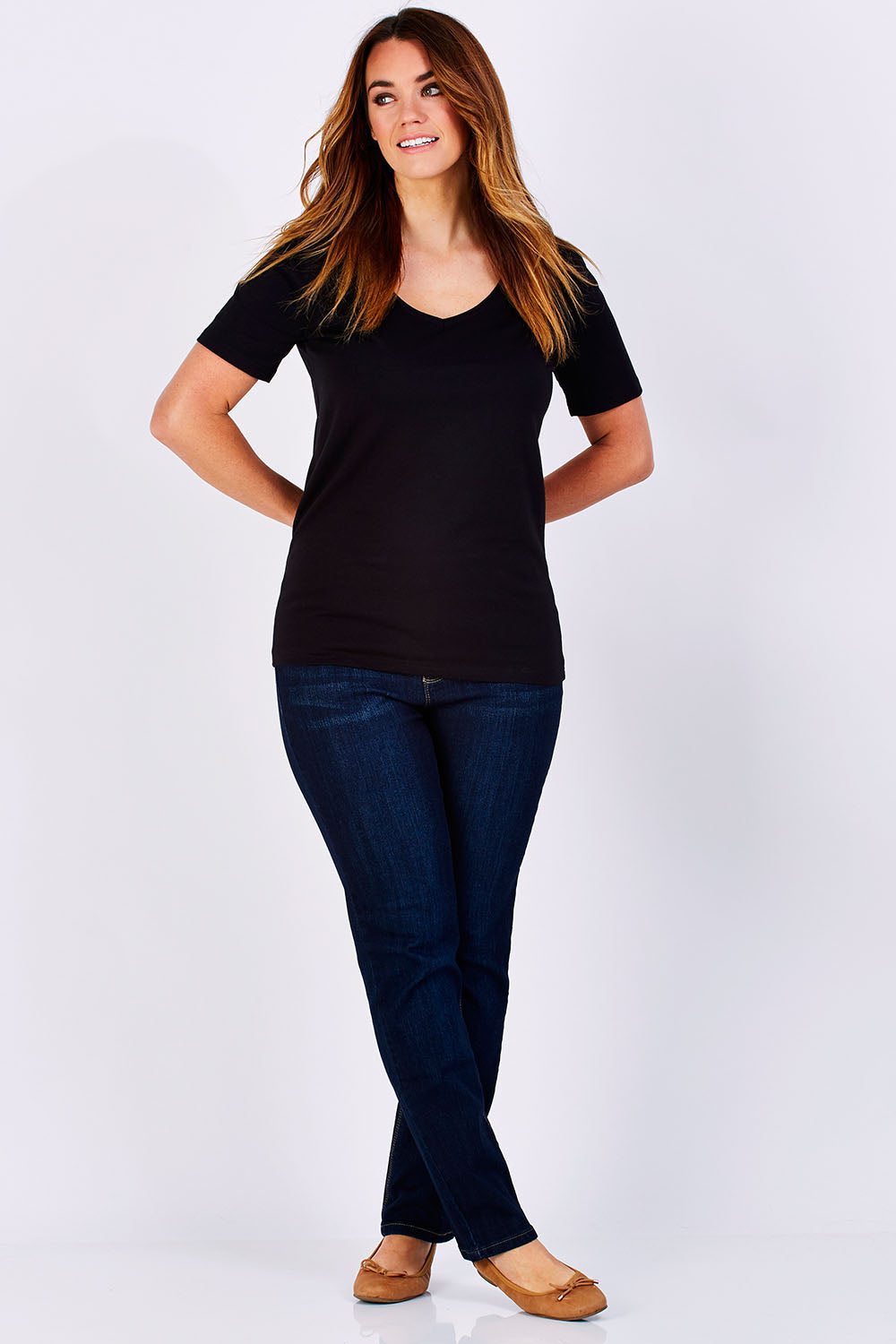 Model Laura wearing size 12 of The Half Sleeve Tee in colour Black (Black), from the front, showing the whole outfit