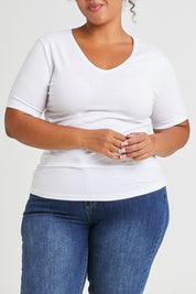Model Alexis wearing size 16 of The Half Sleeve Tee in colour White (White), from the front, cropped image