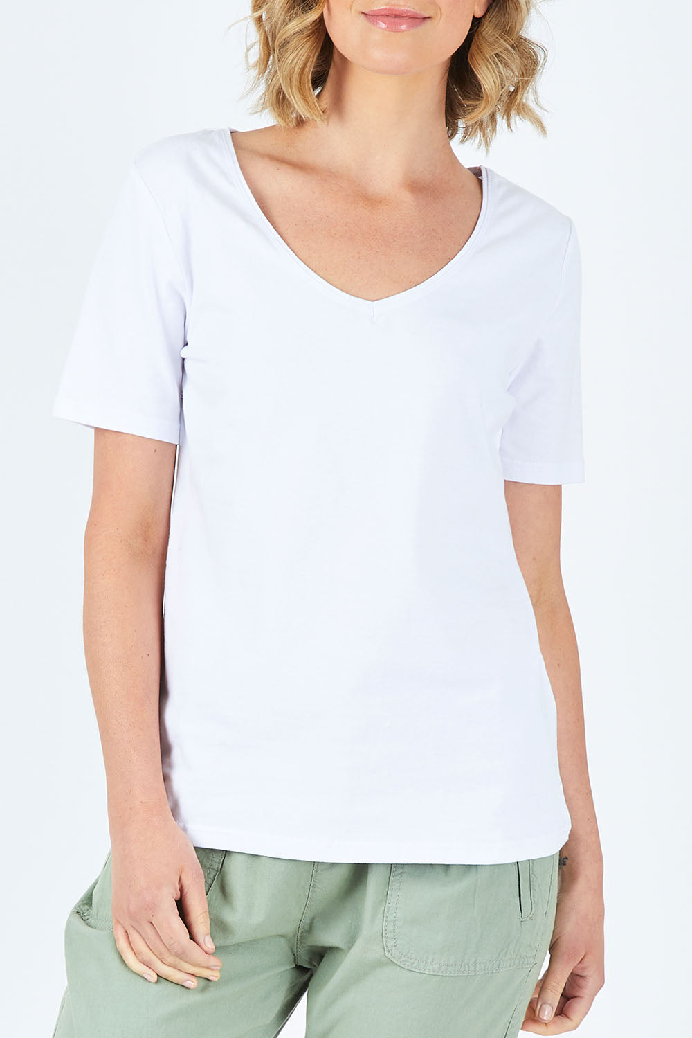 Model Chelsea wearing size 10 of The Half Sleeve Tee in colour White (White), from the front, cropped image