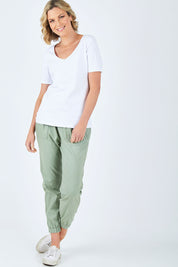 Model Chelsea wearing size 10 of The Half Sleeve Tee in colour White (White), from the front, showing the whole outfit