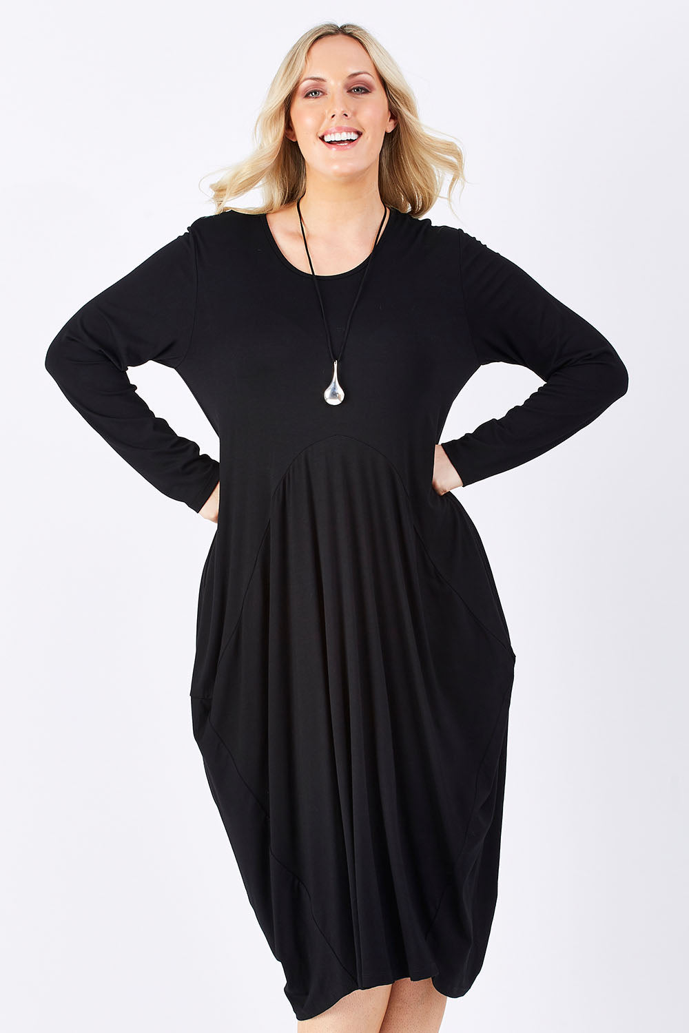 Model Jess wearing size 14 of The Bounce Dress in colour Black (Black), from the front, cropped image