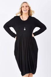 Model Jess wearing size 14 of The Bounce Dress in colour Black (Black), from the front, cropped image