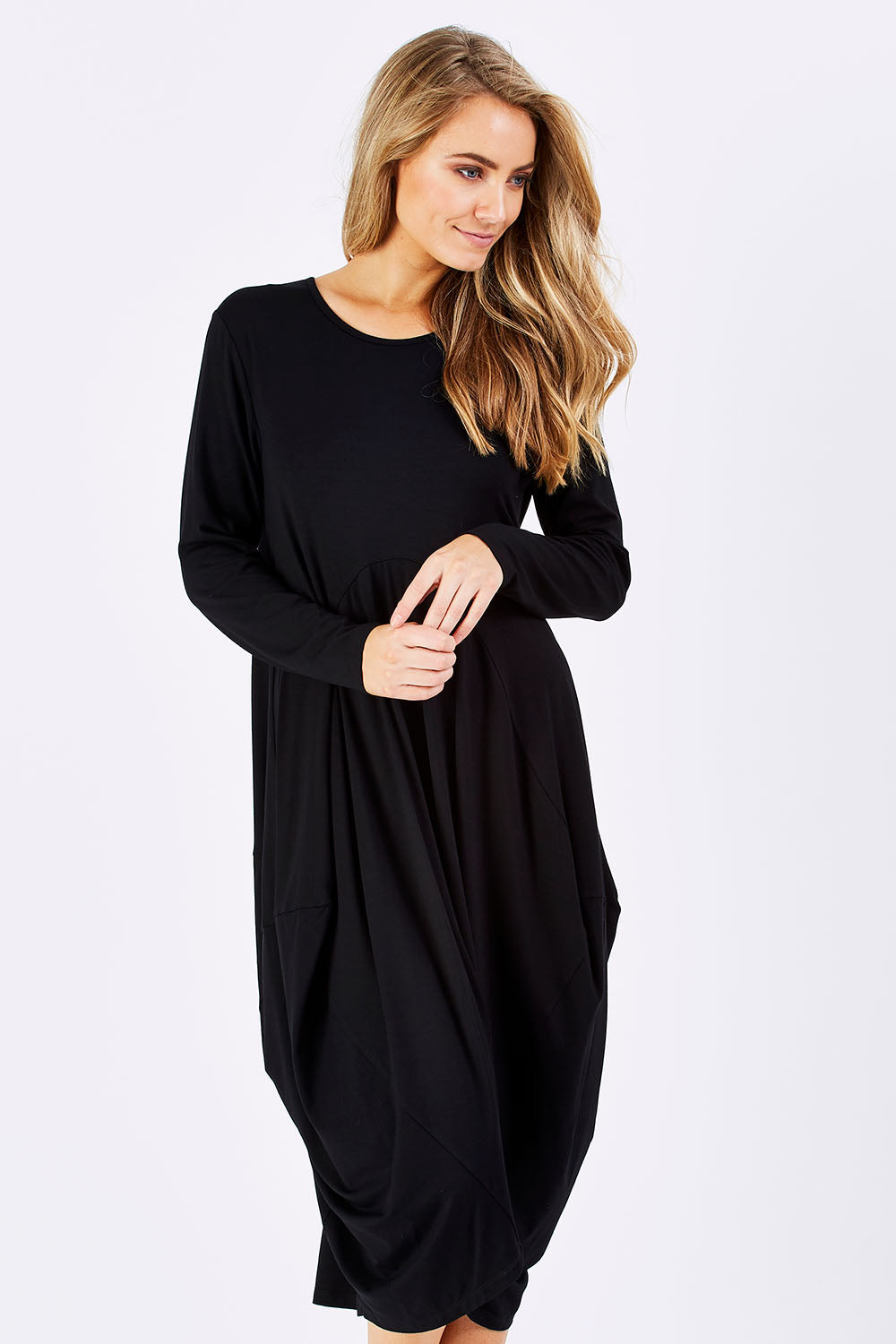 Model Marnee wearing size 10 of The Bounce Dress in colour Black (Black), from the front, cropped image
