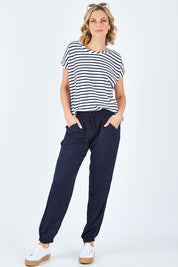 Model Chelsea wearing size 10 of The Soft Utility Pant in colour Navy (Blue), from the front, showing the whole outfit