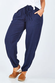 Model Laura wearing size 14 of The Soft Utility Pant in colour Navy (Blue), from the front, cropped image