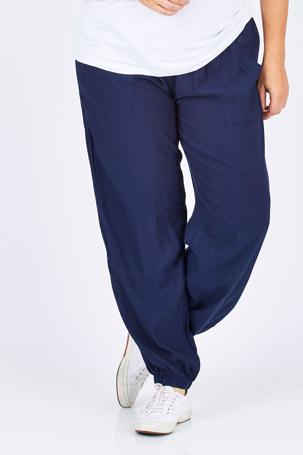 Model Ljubenka wearing size 18 of The Soft Utility Pant in colour Navy (Blue), from the front, cropped image