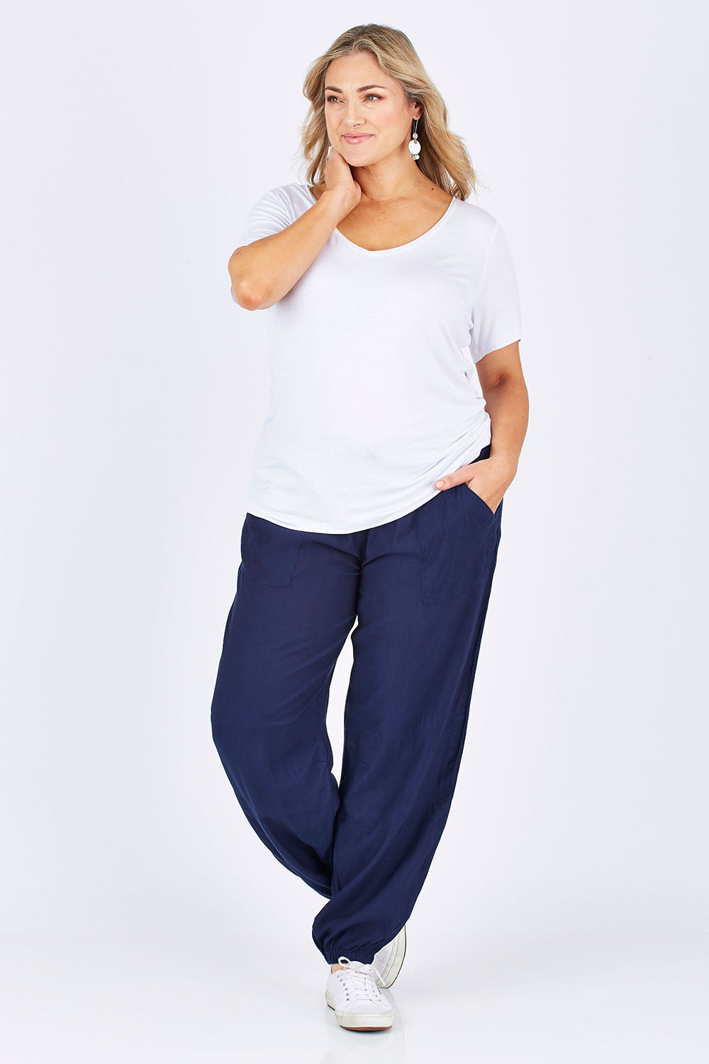 Model Ljubenka wearing size 18 of The Soft Utility Pant in colour Navy (Blue), from the front, showing the whole outfit