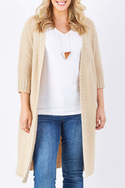 Model Jess wearing size L of The Half Sleeve Cardigan in colour Oatmeal, from the front, cropped image