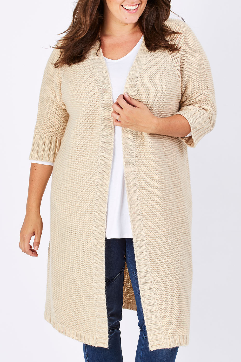 Model Mae wearing size XL of The Half Sleeve Cardigan in colour Oatmeal, from the front, cropped image