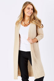 Model Marnee wearing size S of The Half Sleeve Cardigan in colour Oatmeal, from the front, cropped image