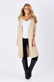 Model Marnee wearing size S of The Half Sleeve Cardigan in colour Oatmeal, from the front, showing the whole outfit
