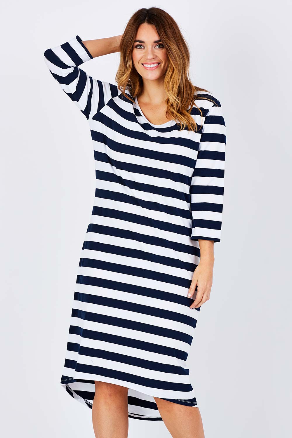 Model Laura wearing size 12 of The High Low Midi Dress in colour NavyWhite (Blue), from the front, cropped image