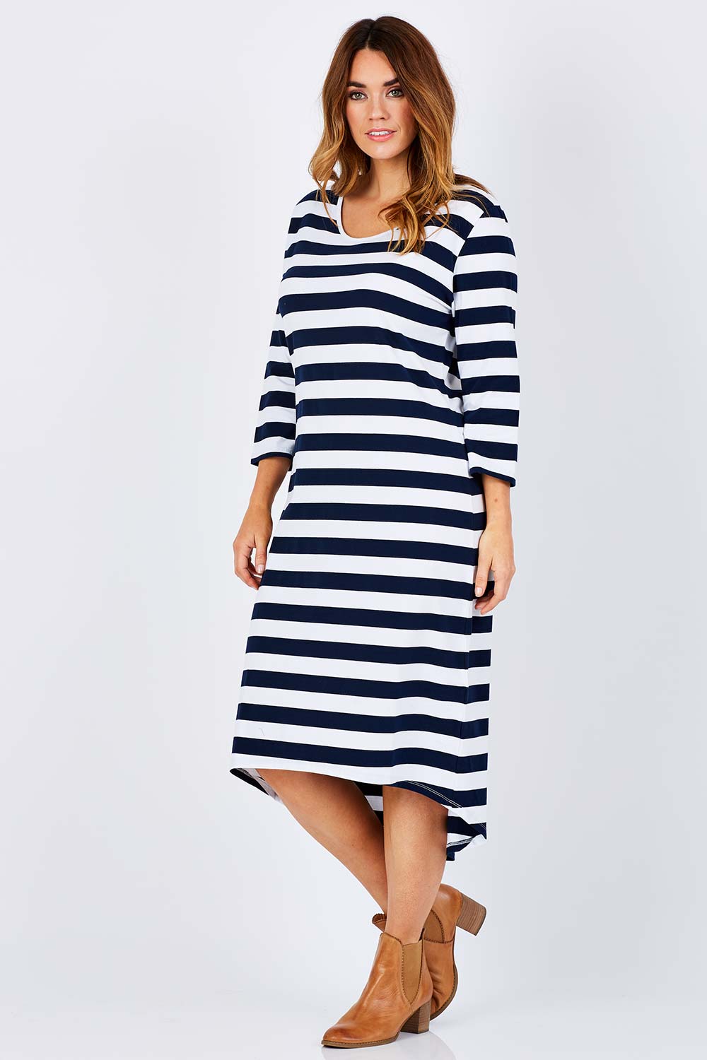 Model Laura wearing size 12 of The High Low Midi Dress in colour NavyWhite (Blue), from the front, showing the whole outfit