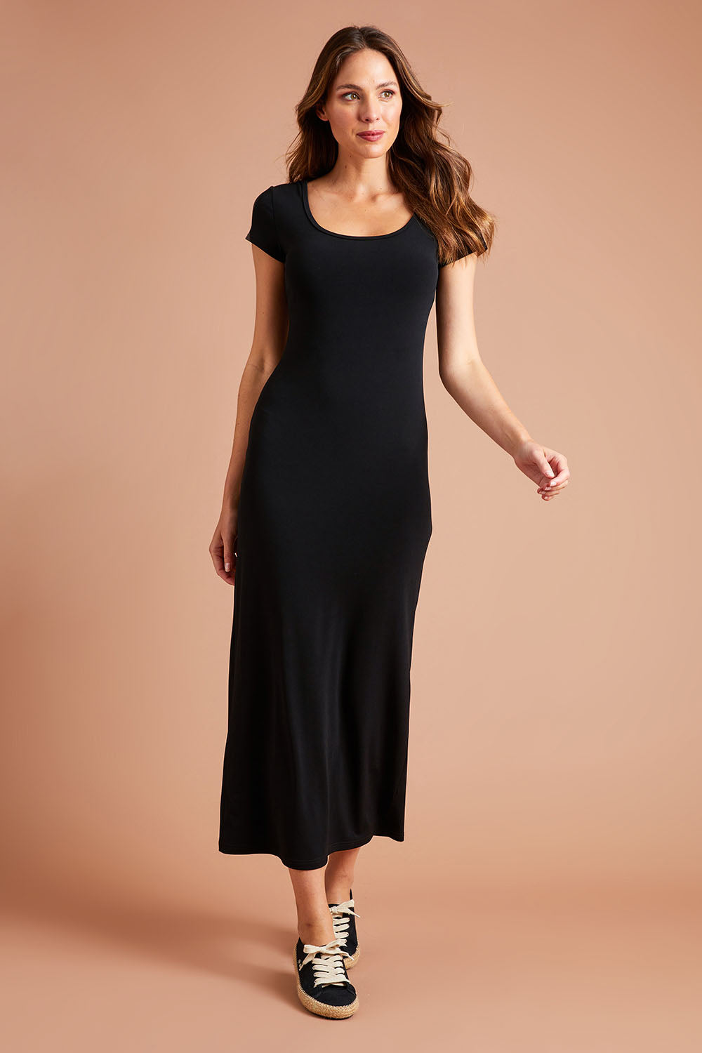 Model Madeline wearing size 10 of The Cap Sleeve Maxi Dress in colour Black (Black), from the front, showing the whole outfit