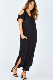 Model Laura wearing size 14 of The Shoulder Splice Maxi Dress in colour Black (Black), from the front, showing the whole outfit
