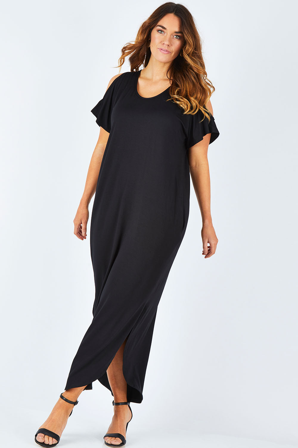 Model Laura wearing size 14 of The Shoulder Splice Maxi Dress in colour Black (Black), from the front, showing the whole outfit