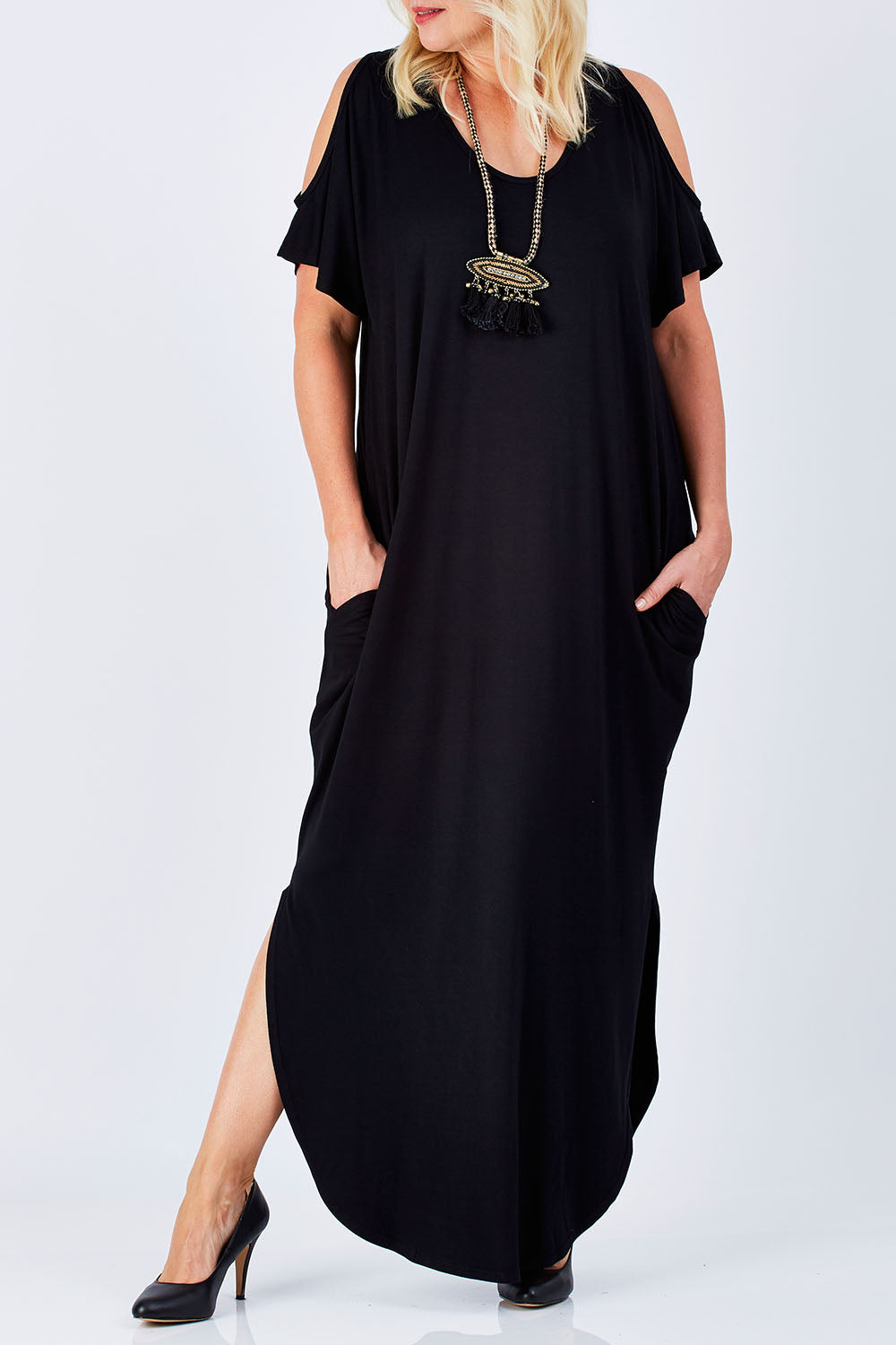 Model Natalie wearing size 16 of The Shoulder Splice Maxi Dress in colour Black (Black), from the front, cropped image