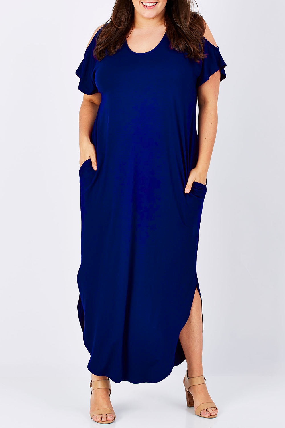 Model Jess wearing size 16 of The Shoulder Splice Maxi Dress in colour Sapphire (Blue), from the front, cropped image