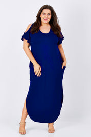 Model Jess wearing size 16 of The Shoulder Splice Maxi Dress in colour Sapphire (Blue), from the front, showing the whole outfit