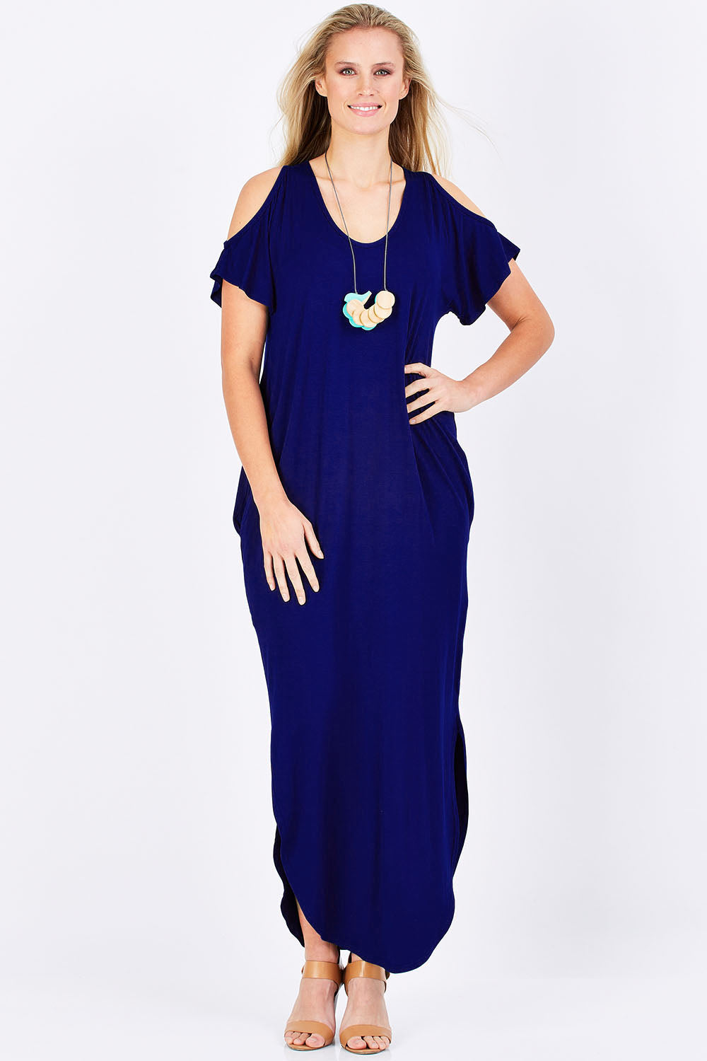 Model Maddy wearing size 10 of The Shoulder Splice Maxi Dress in colour Sapphire (Blue), from the front, showing the whole outfit