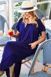 Model Olivia wearing size 12 of The Shoulder Splice Maxi Dress in colour Sapphire (Blue), from the front, showing the whole outfit