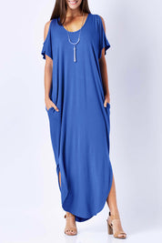Model Anna wearing size 10 of The Shoulder Splice Maxi Dress in colour Splash (Blue), from the front, cropped image