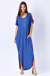 Model Anna wearing size 10 of The Shoulder Splice Maxi Dress in colour Splash (Blue), from the front, showing the whole outfit