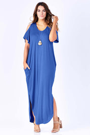 Model Laura wearing size 12 of The Shoulder Splice Maxi Dress in colour Splash (Blue), from the front, showing the whole outfit