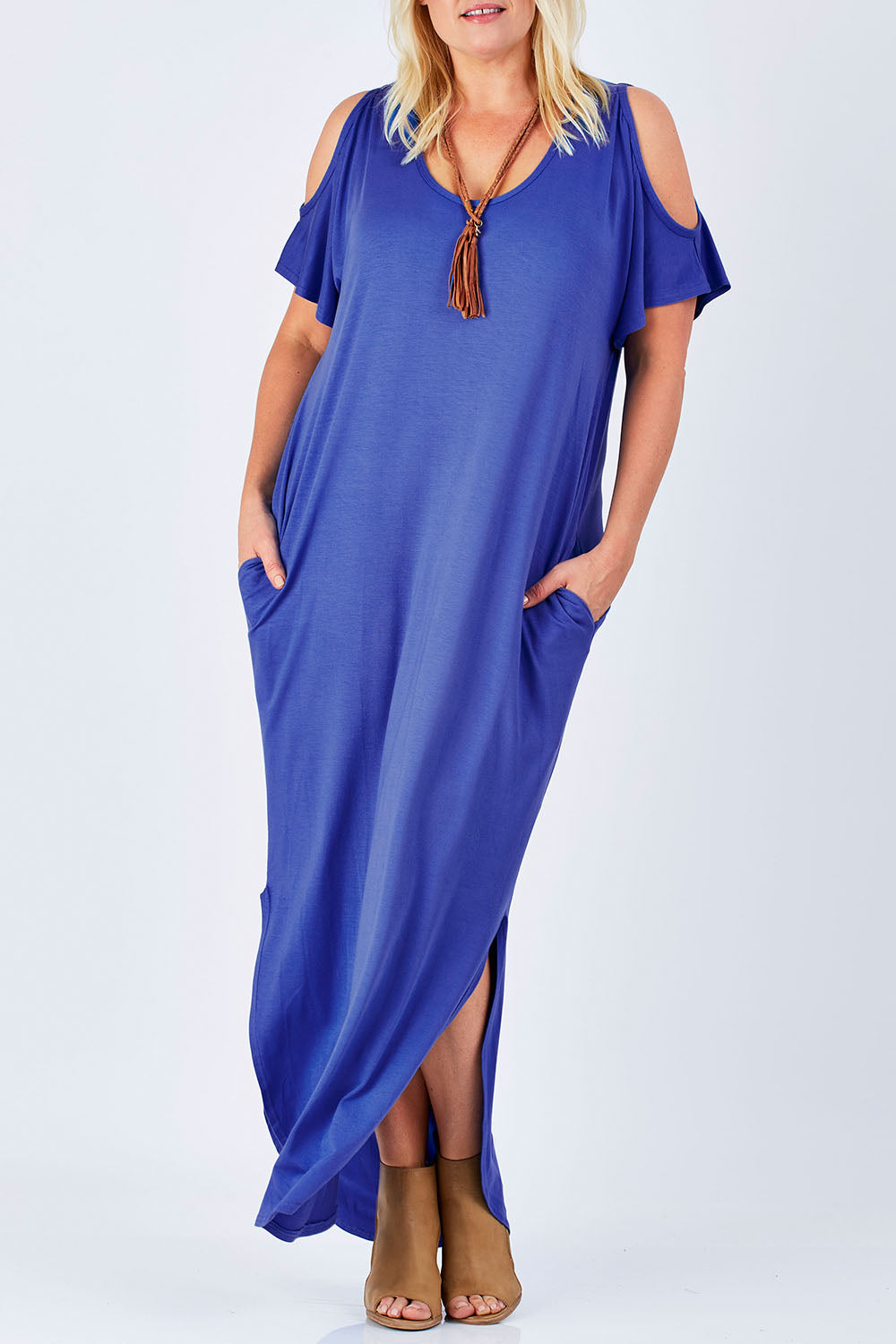 Model Natalie wearing size 16 of The Shoulder Splice Maxi Dress in colour Splash (Blue), from the front, cropped image