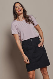 Model Amanda wearing size 10 of The Cotton Cargo Skirt in colour Black (Black), from the front, cropped image