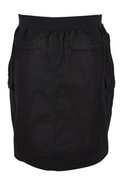 Product shot of The Cotton Cargo Skirt in colour Black (Black), from the back