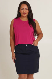 Model Ashleigh wearing size 16 of The Cotton Cargo Skirt in colour Navy (Blue), from the front, cropped image