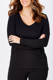Model Laura wearing size 12 of The Relaxed Long Sleeve Tee in colour Black (Black), from the front, cropped image