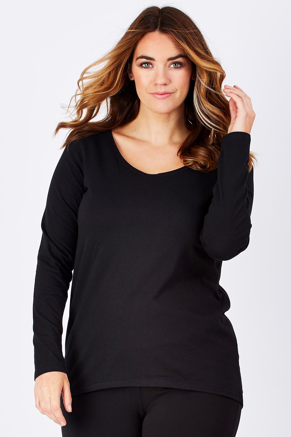 Model Laura wearing size 12 of The Relaxed Long Sleeve Tee in colour Black (Black), from the front, cropped image