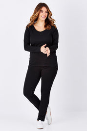 Model Laura wearing size 12 of The Relaxed Long Sleeve Tee in colour Black (Black), from the front, showing the whole outfit