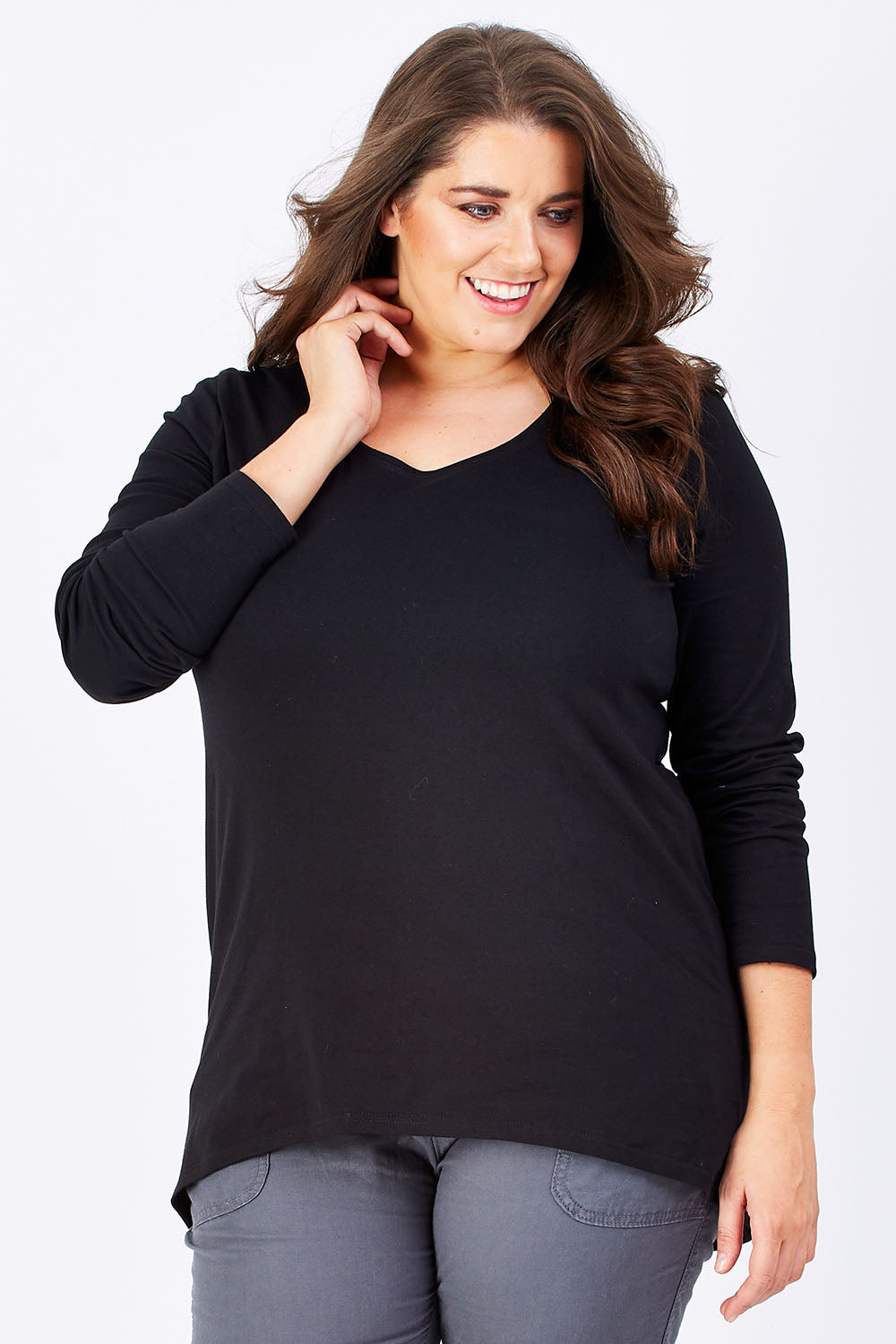 Model Mae wearing size 16 of The Relaxed Long Sleeve Tee in colour Black (Black), from the front, cropped image
