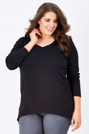 Model Mae wearing size 16 of The Relaxed Long Sleeve Tee in colour Black (Black), from the front, cropped image