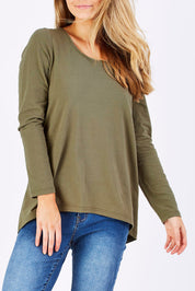 Model Marnee wearing size 10 of The Relaxed Long Sleeve Tee in colour Khaki (Green), from the front, cropped image