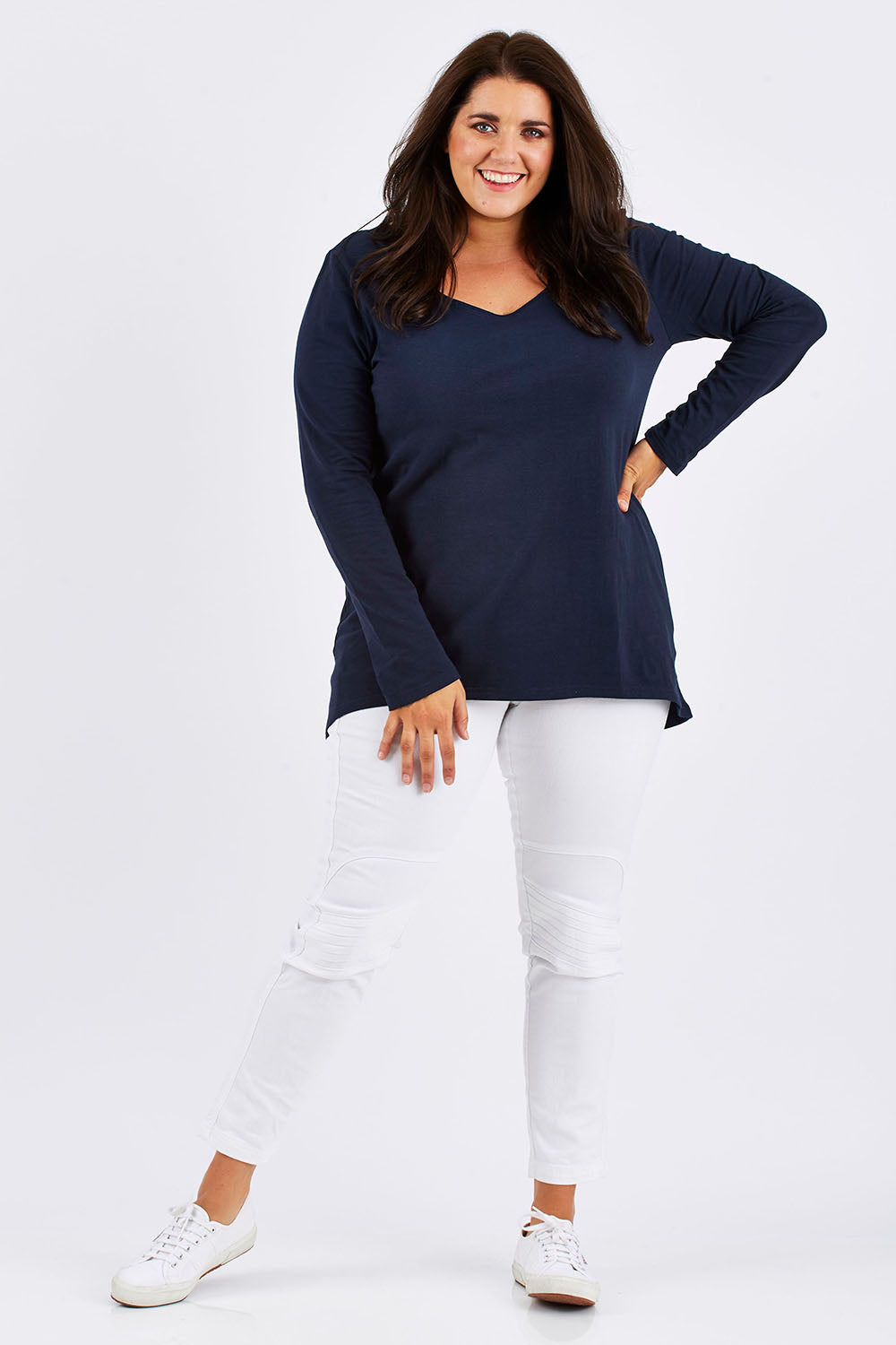 Model Mae wearing size 18 of The Relaxed Long Sleeve Tee in colour Navy (Black), from the front, showing the whole outfit