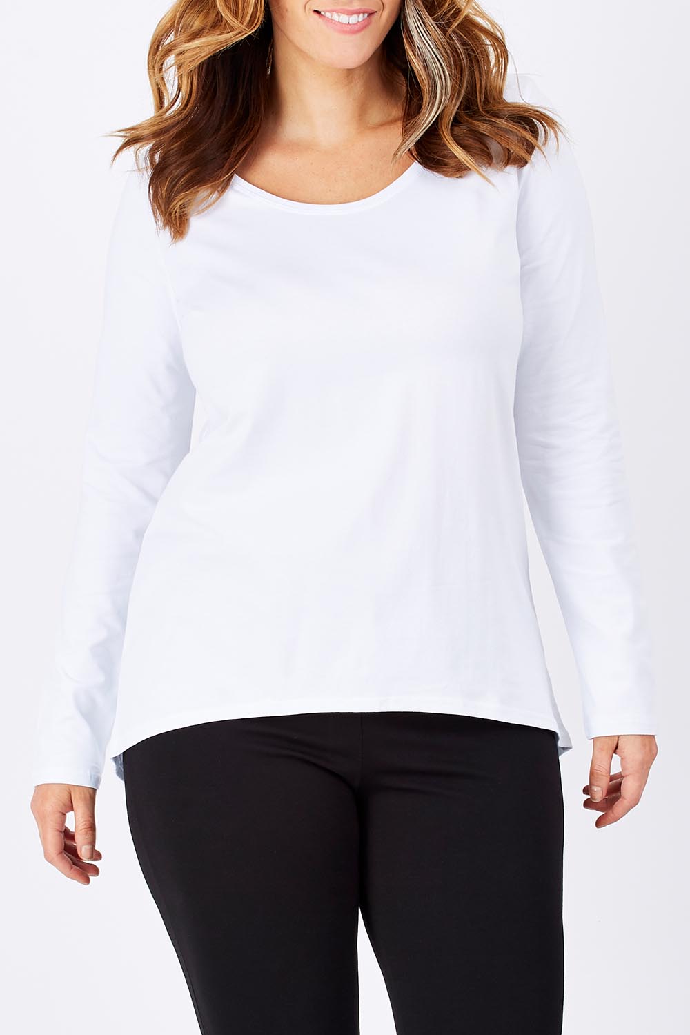 Model Laura wearing size 12 of The Relaxed Long Sleeve Tee in colour White (White), from the front, cropped image