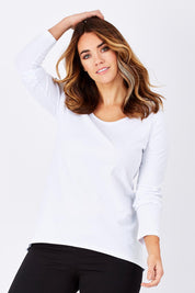 Model Laura wearing size 12 of The Relaxed Long Sleeve Tee in colour White (White), from the front, cropped image