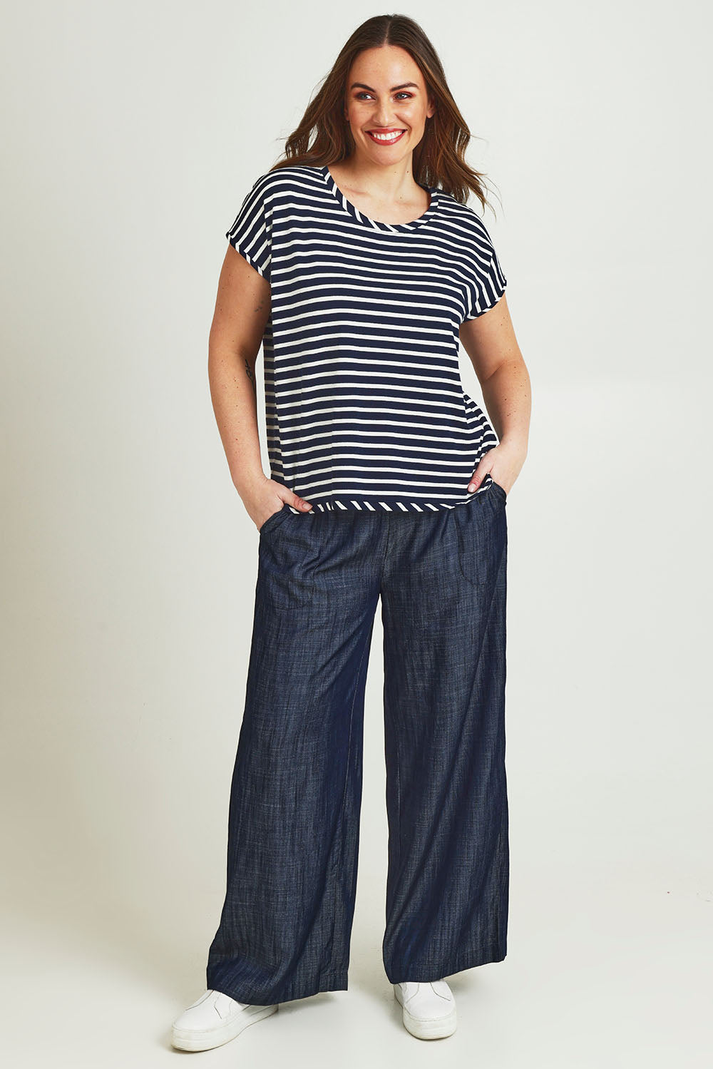 Model Jane wearing size 14 of The Striped Drape Tee in colour Navywhite (Blue), from the front, showing the whole outfit
