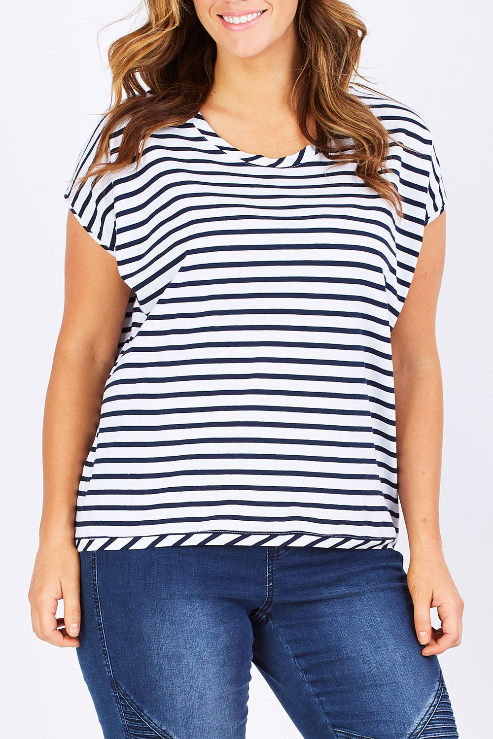 Model Laura wearing size 12 of The Drape Tee in colour NavyStripe (Blue), from the front, cropped image