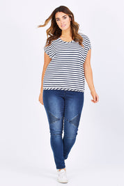 Model Laura wearing size 12 of The Drape Tee in colour NavyStripe (Blue), from the front, showing the whole outfit