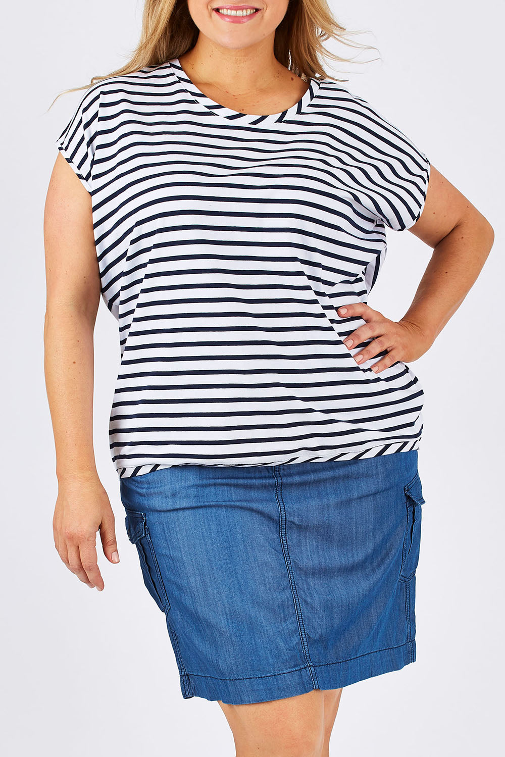 Model Ljubenka wearing size 18 of The Drape Tee in colour NavyStripe (Blue), from the front, cropped image