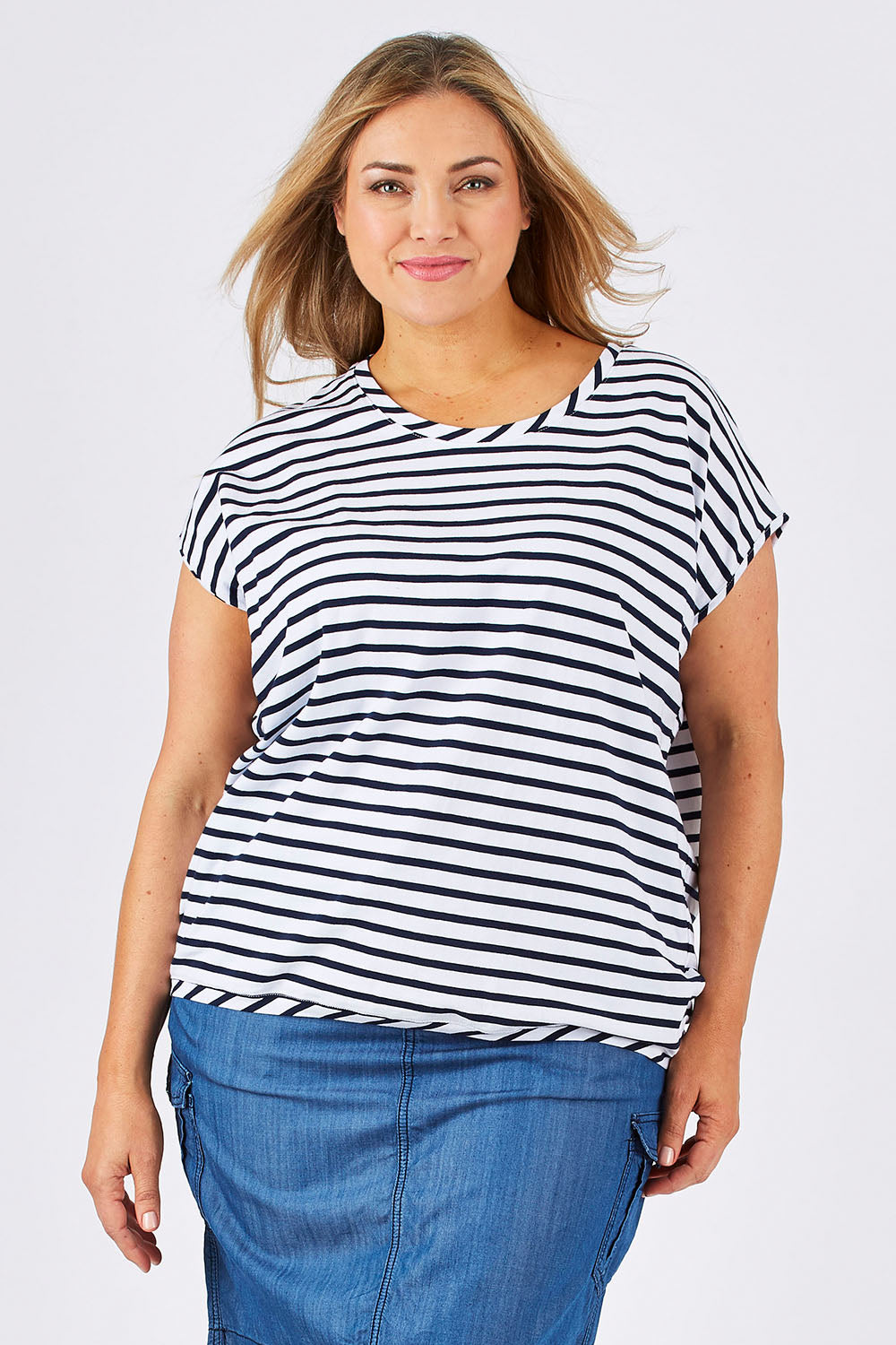 Model Ljubenka wearing size 18 of The Drape Tee in colour NavyStripe (Blue), from the front, cropped image