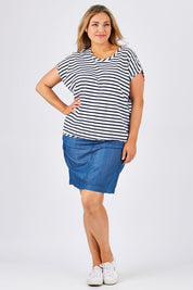Model Ljubenka wearing size 18 of The Drape Tee in colour NavyStripe (Blue), from the front, showing the whole outfit